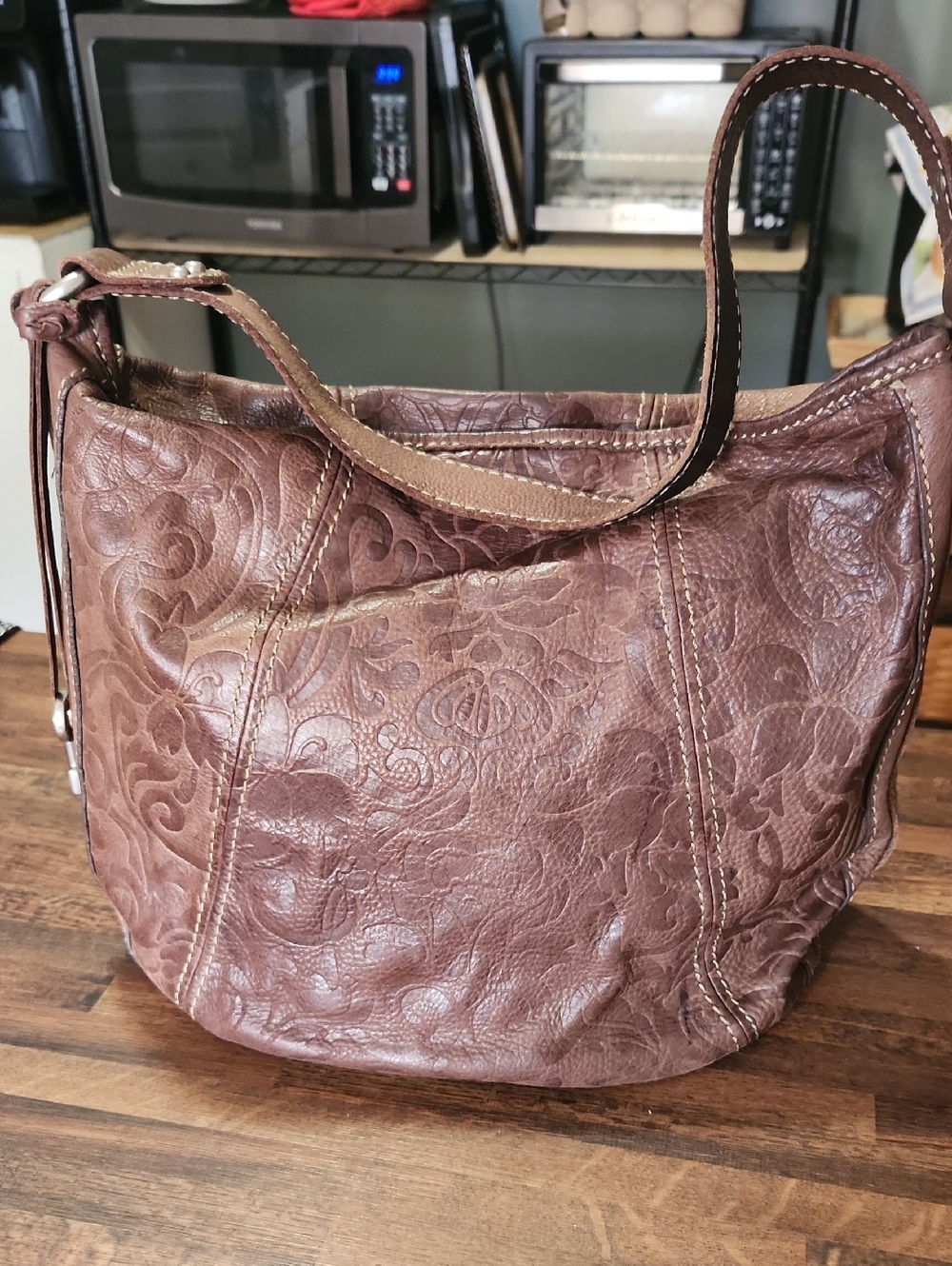 The SAK EMBOSSED LEATHER HOBO BAG